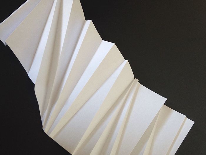High angle view of crumpled paper against black background