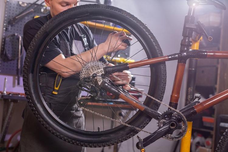 Man working with bicycle wheel