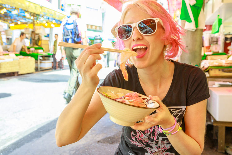 Young woman eating ice cream