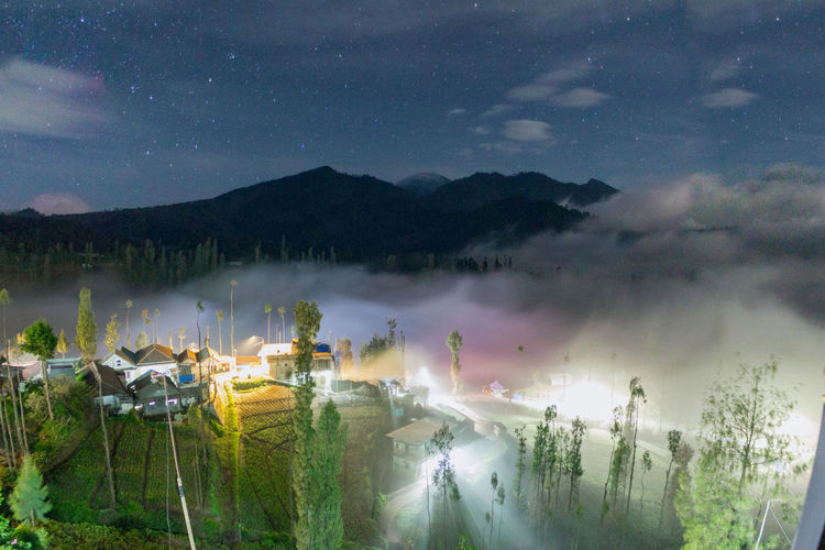 Panoramic view of landscape against sky at night