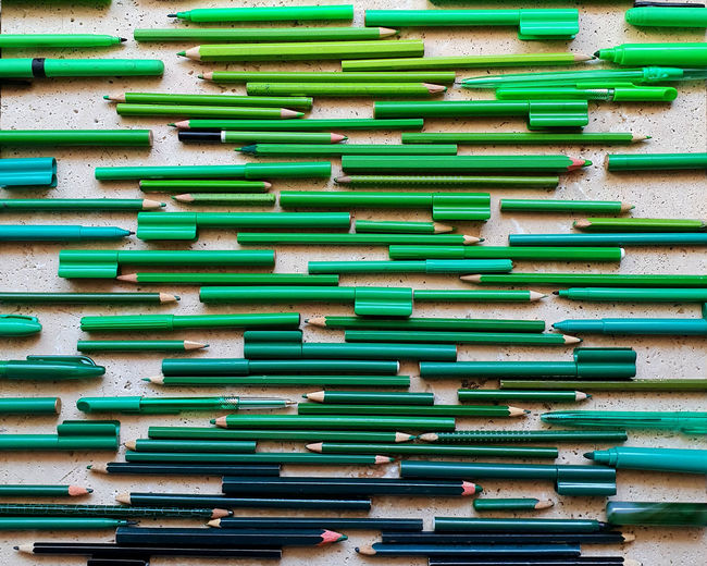 Full frame shot of multi colored green pencils 