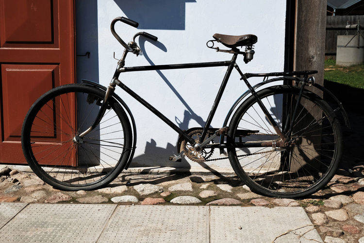 Vintage bicycle parked on footpath