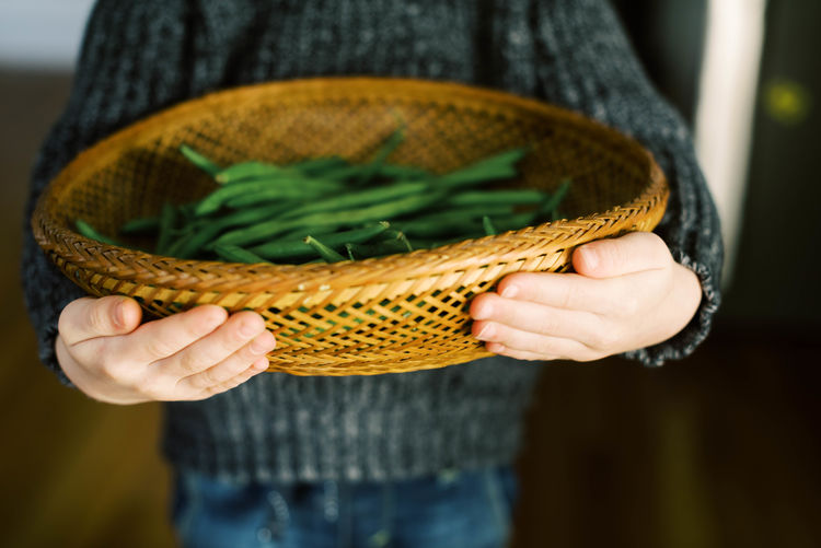 Close-up of woman holding basket