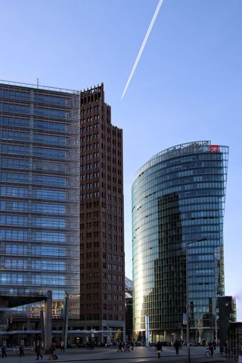Low angle view of buildings against clear blue sky