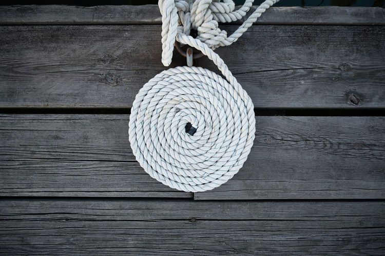 Directly above shot of rope on wooden table