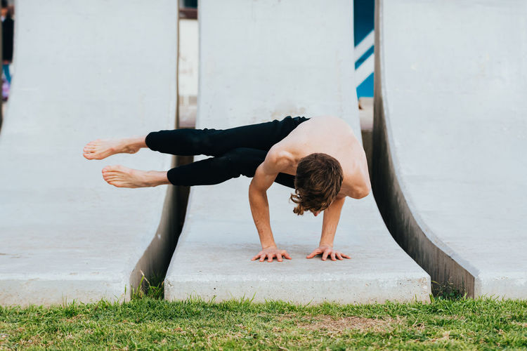 Full length of man exercising at park