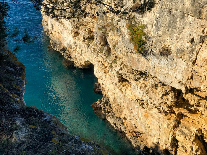 High angle view of rock formation in sea