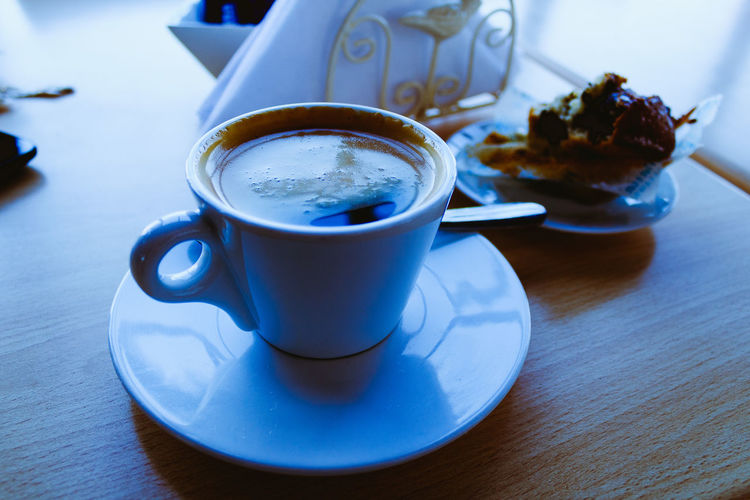 Close-up of coffee cup on table