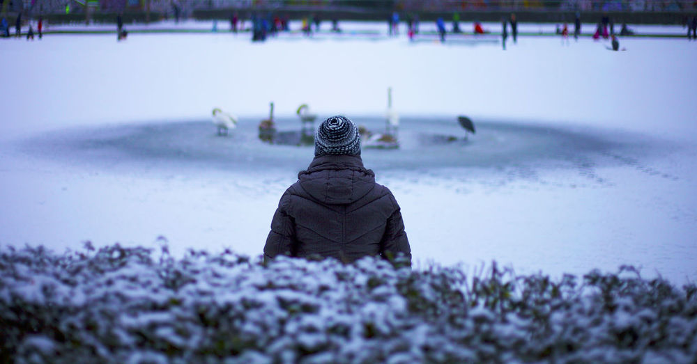 Rear view of person during winter
