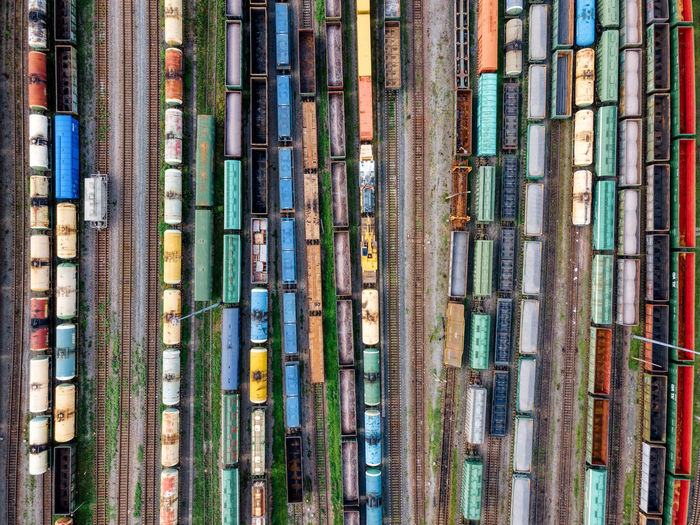 Aerial photo of railway lines. freight wagons with goods on railroad station. cargo transportation.