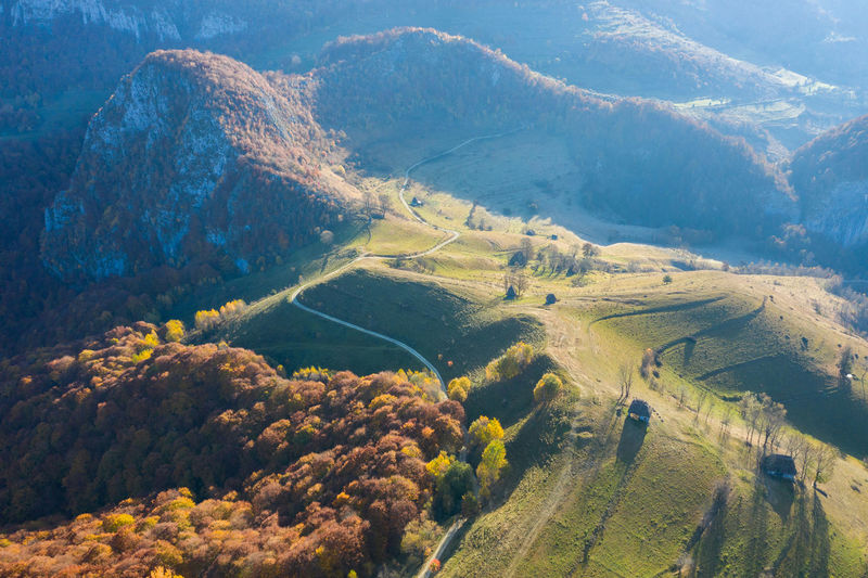 Aerial drone autumn countryside landscape with wooden houses, thatched roof. transylvania, romania