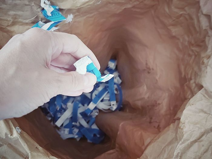 High angle view of person holding plastic bag