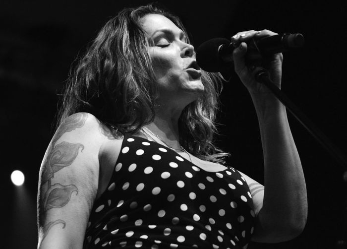 Low angle view of woman singing in concert