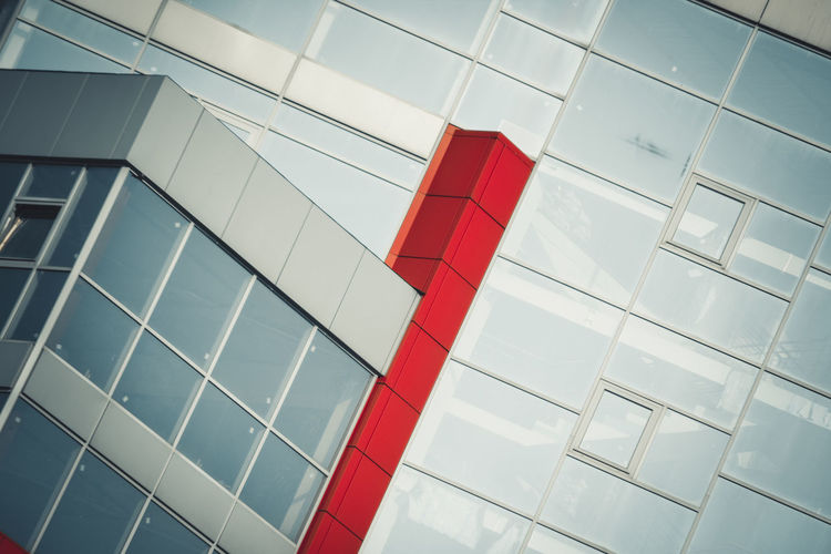 Gray red facade of a modern building angled, filter