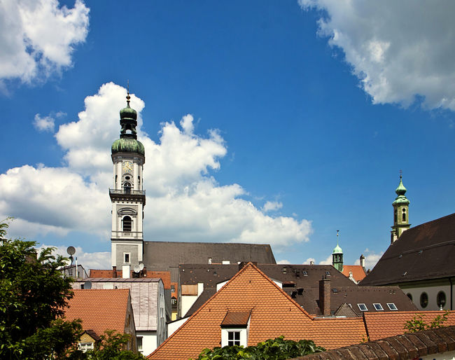 View of buildings in town against sky