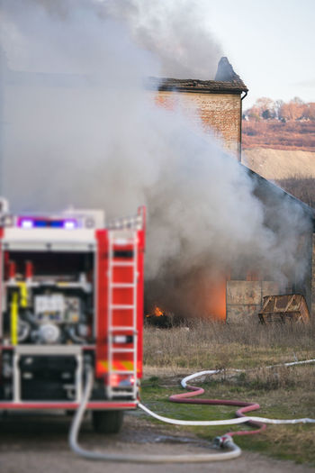 Fire truck against burning house