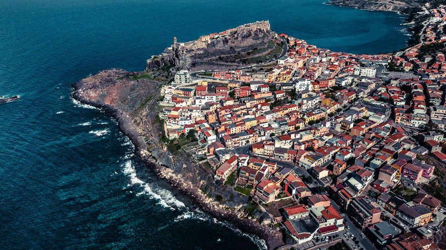 Aerial view of townscape by sea