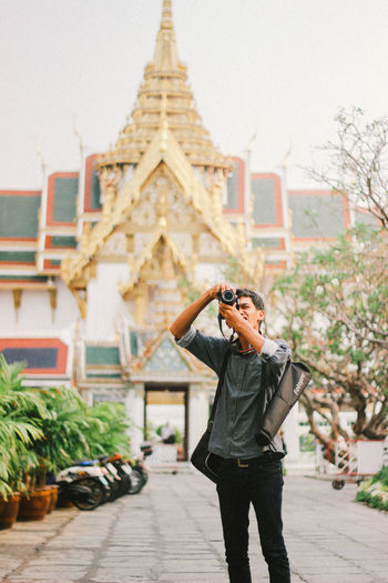 Man photographing at temple
