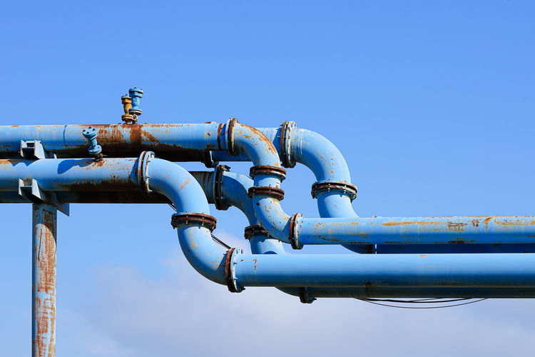 Low angle view of metallic structure against clear sky