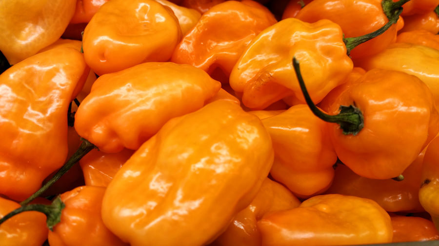 Close-up of orange bell peppers for sale in market