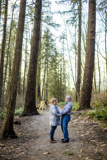 Retired couple sharing a laugh in nature