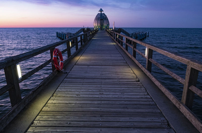 Illuminated famous pier and baltic sea at dawn in the city of sellin on the island of rügen