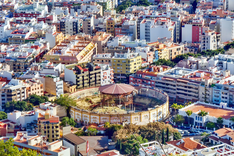 View of the city of santa cruz on tenerife. in the foreground is the old , no  used bullring 
