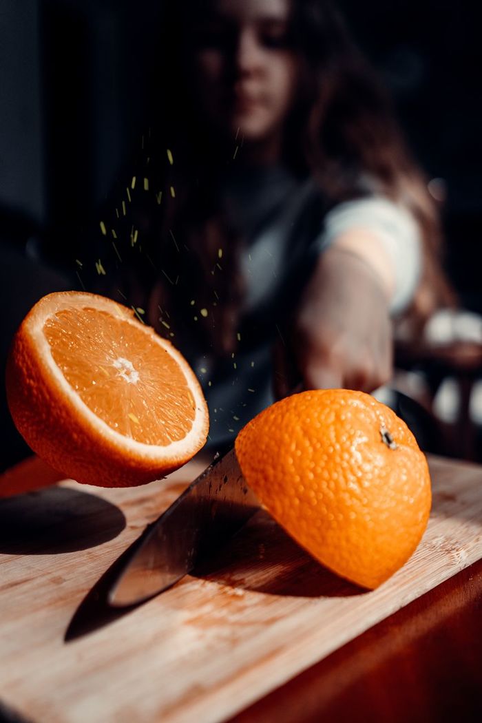 Orange fruit on cutting board