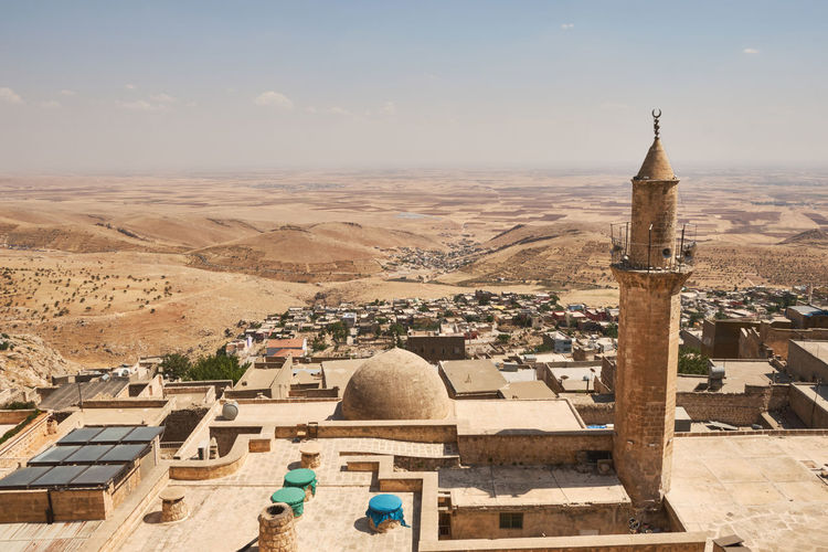 Panoramic view of mardin sanitary historical emir hamam baths, city roofs and mesopotamian plain