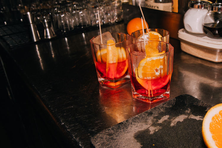 Orange slices in cocktails on table