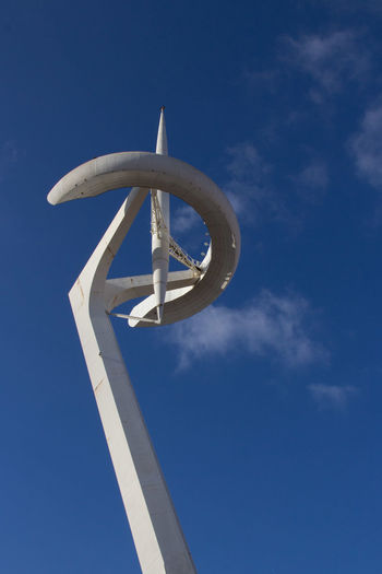 Low angle view of sculpture against blue sky