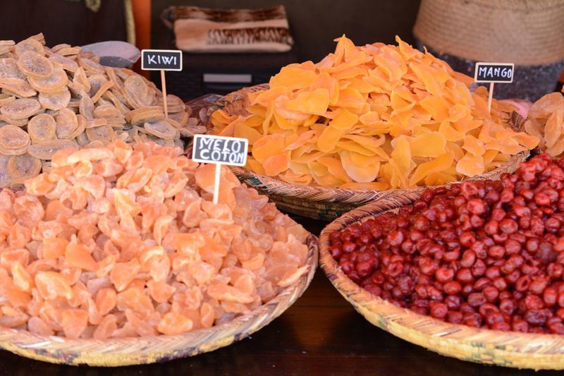 Various dried fruits in plate at market