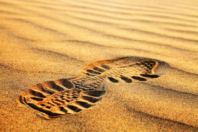 Close-up of footprint on rippled sand