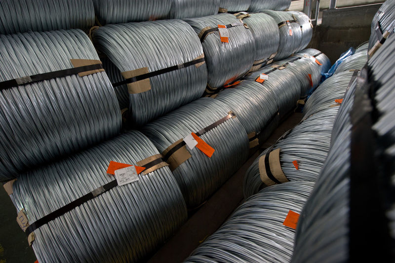 High angle view of metallic rolled up wires at steel plant