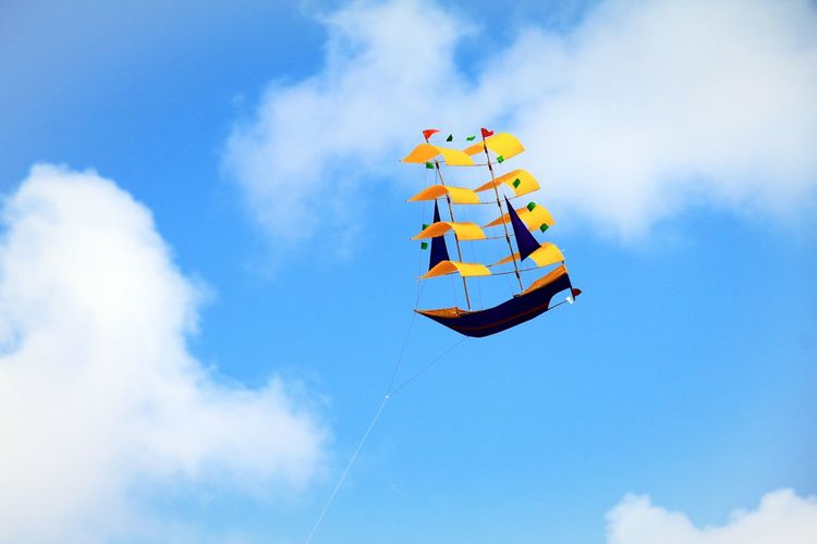 Low angle view of kite flying in sky