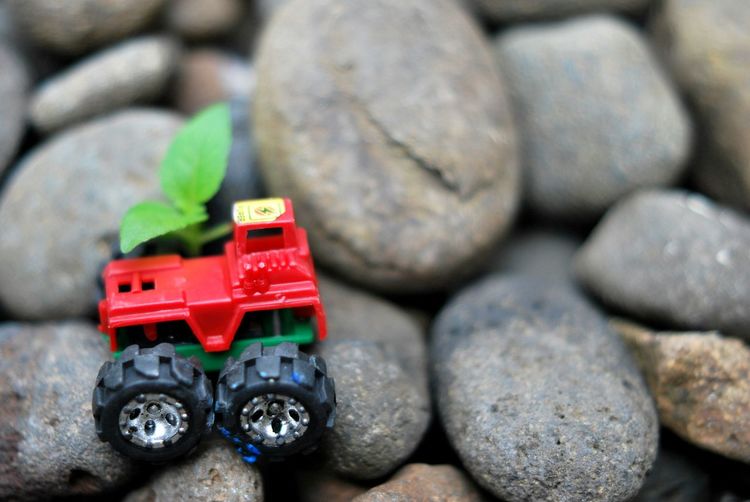 Close-up of toy car on rocks