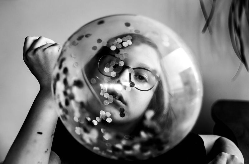 Cropped hand of woman holding crystal ball