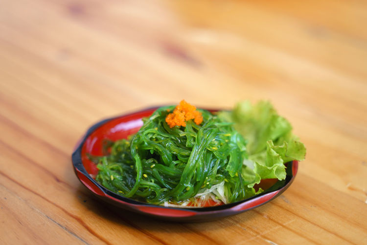 Close-up of chopped vegetables in bowl on table