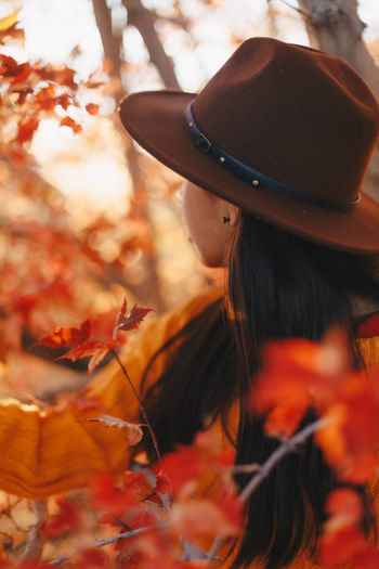 Portrait of woman with autumn leaves
