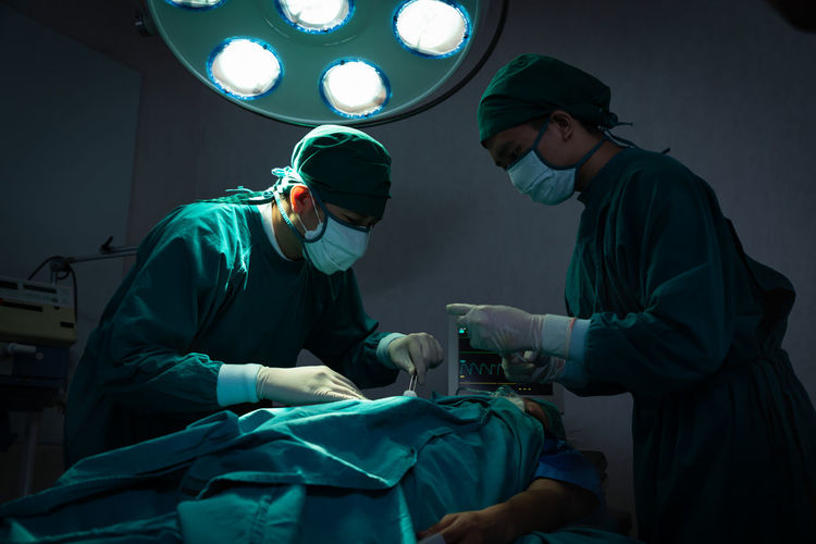 Surgeons performing surgery at operating room