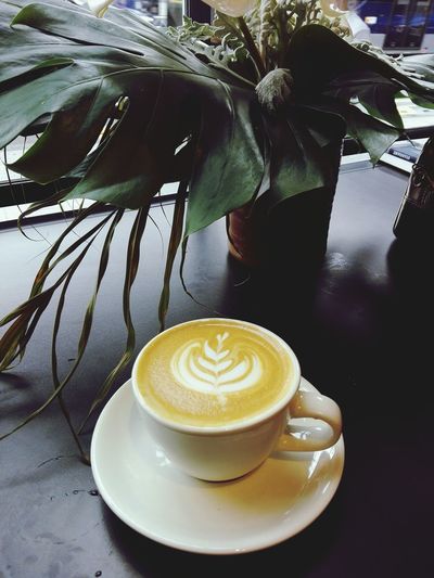 Close-up of cappuccino on table