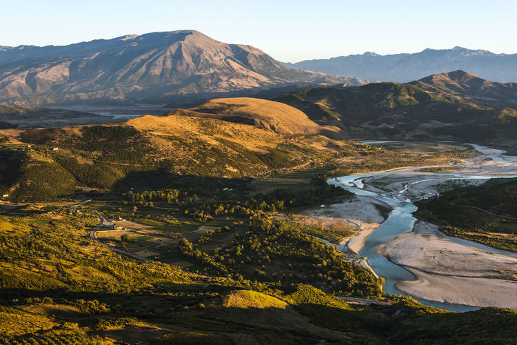 Scenic view of landscape and mountains against sky