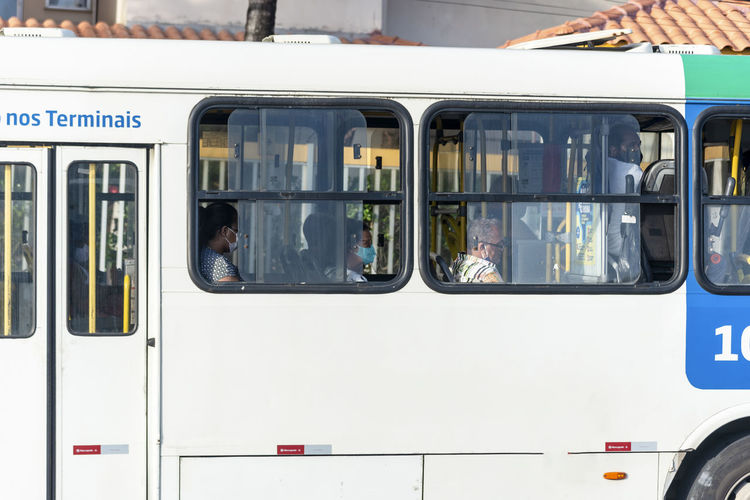 People inside the bus wearing protective mask against coronavirus. 