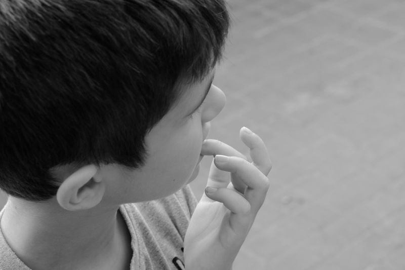 Close-up of boy eating baby