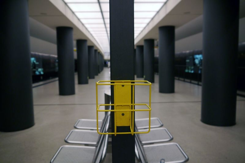 Seats and empty yellow mailbox at berlin hauptbahnhof