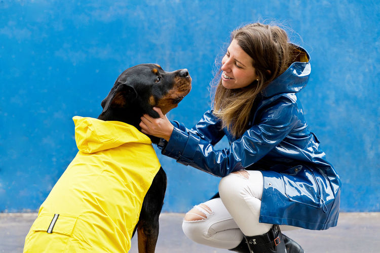Portrait of young woman with dog