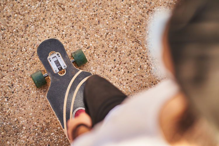 Low section of man skateboarding on skateboard