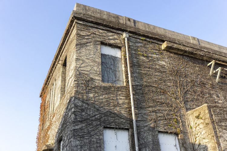 Low angle view of old building against clear sky