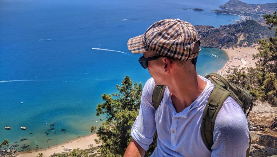 High angle view of man sitting against sea at rhodes island