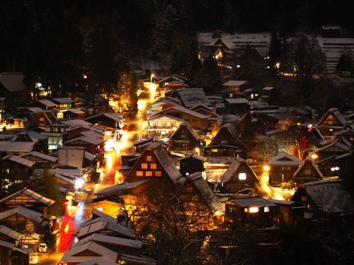 High angle view of illuminated buildings in city during winter